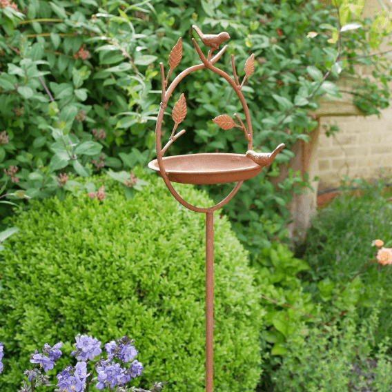 Rustic Metal Bird Feeder on a Stake with Leaves and Birds Detail