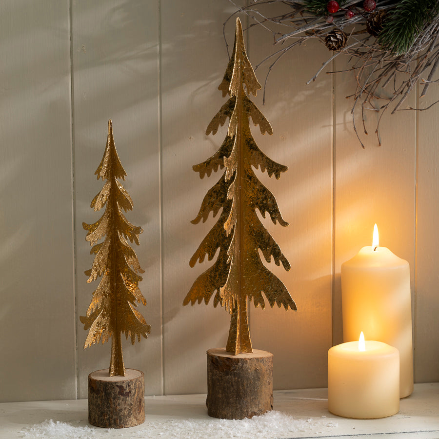 Metal Christmas Tree Ornament with Gold Finish on a Wooden Base